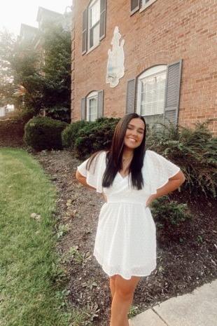 W&J senior Carlee Stelter poses in front of Delta Gamma house